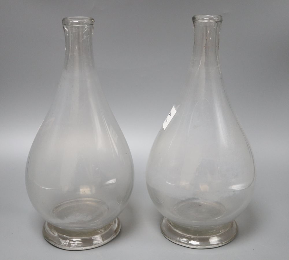 A pair of glass carafe vases, height 30cm
